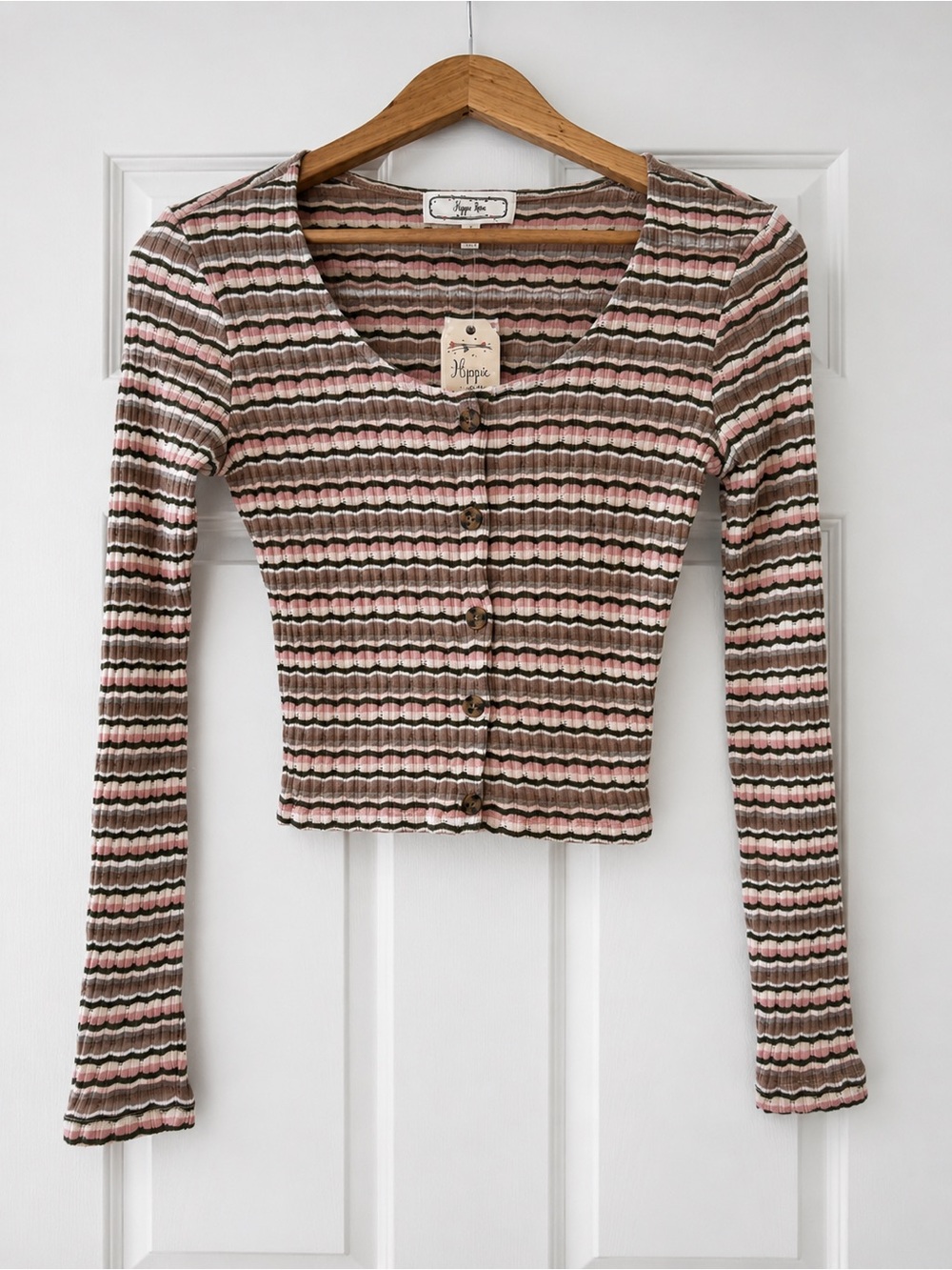 Trendy ribbed knit crop cardigan with stretch, button front, and soft neutral